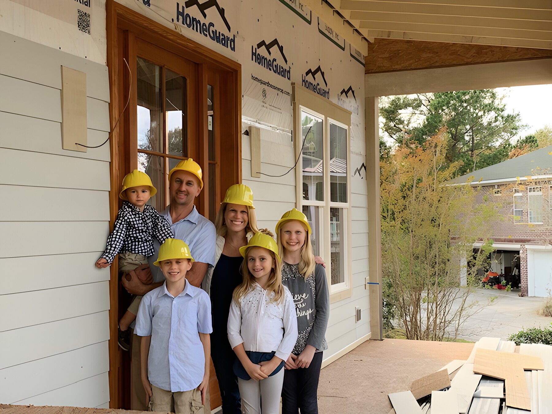 Jason with his family at a job site